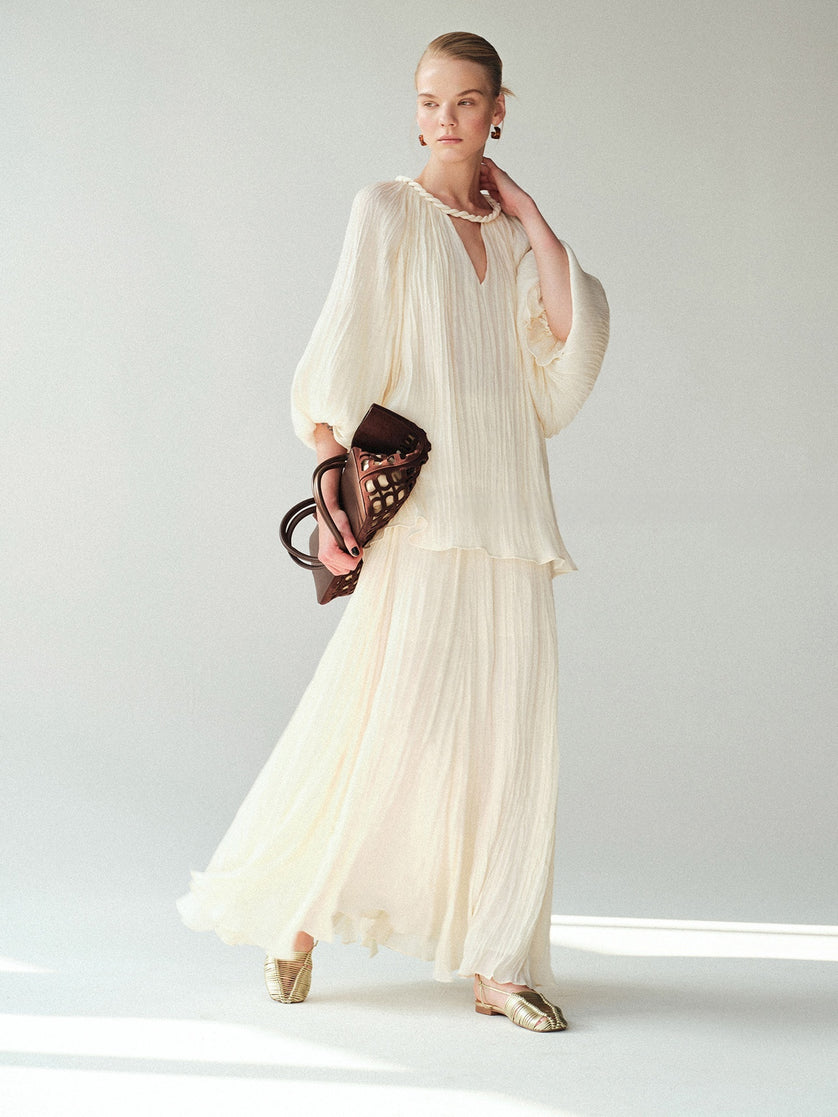 White pleated maxi skirt resort outfit inspiration